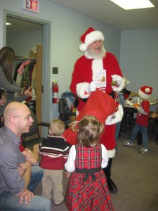 Photo of the end of winter term party 2012, with Santa and children.