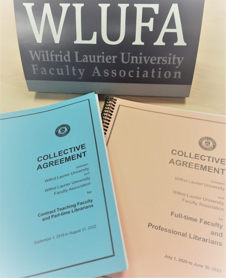 Photo of Collective Agreements and WLUFA sign