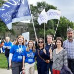 Photo of Ryan Ladner with other Faculty Associations at Brescia Rally